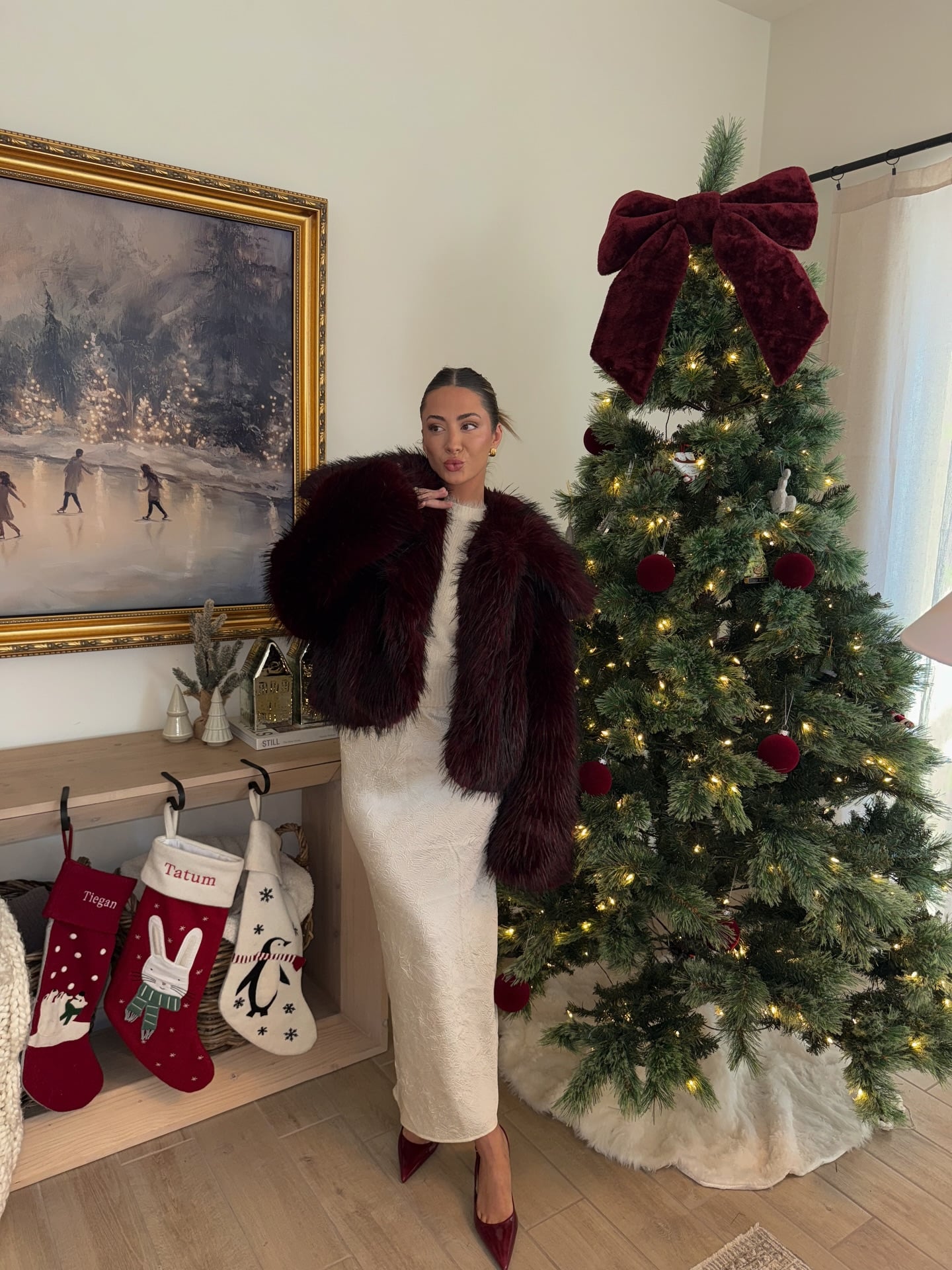 Cream textured maxi dress with burgundy faux-fur jacket and matching heels for Christmas Eve dinner.