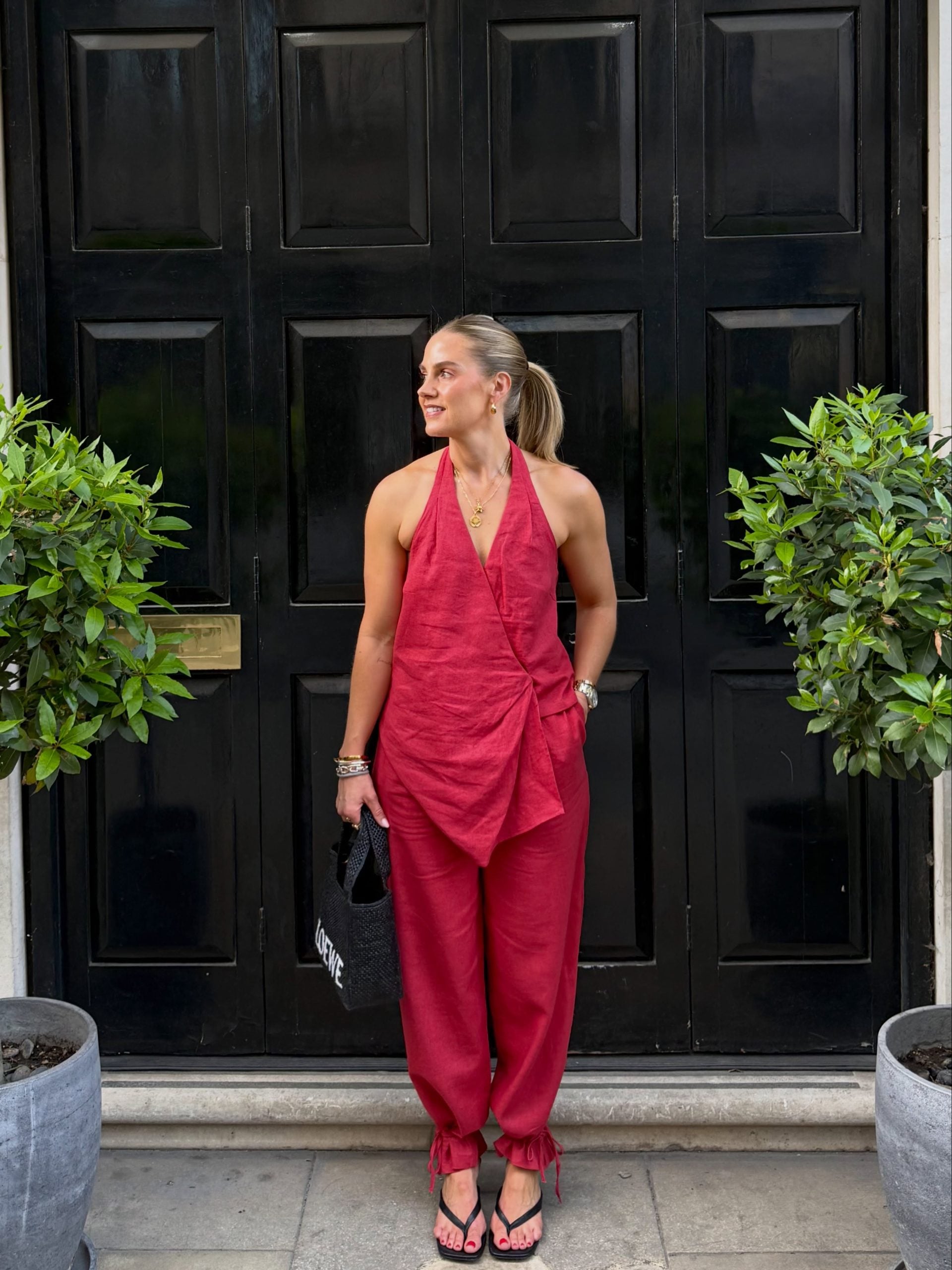 red monochromatic outfit with a halter top and trousers