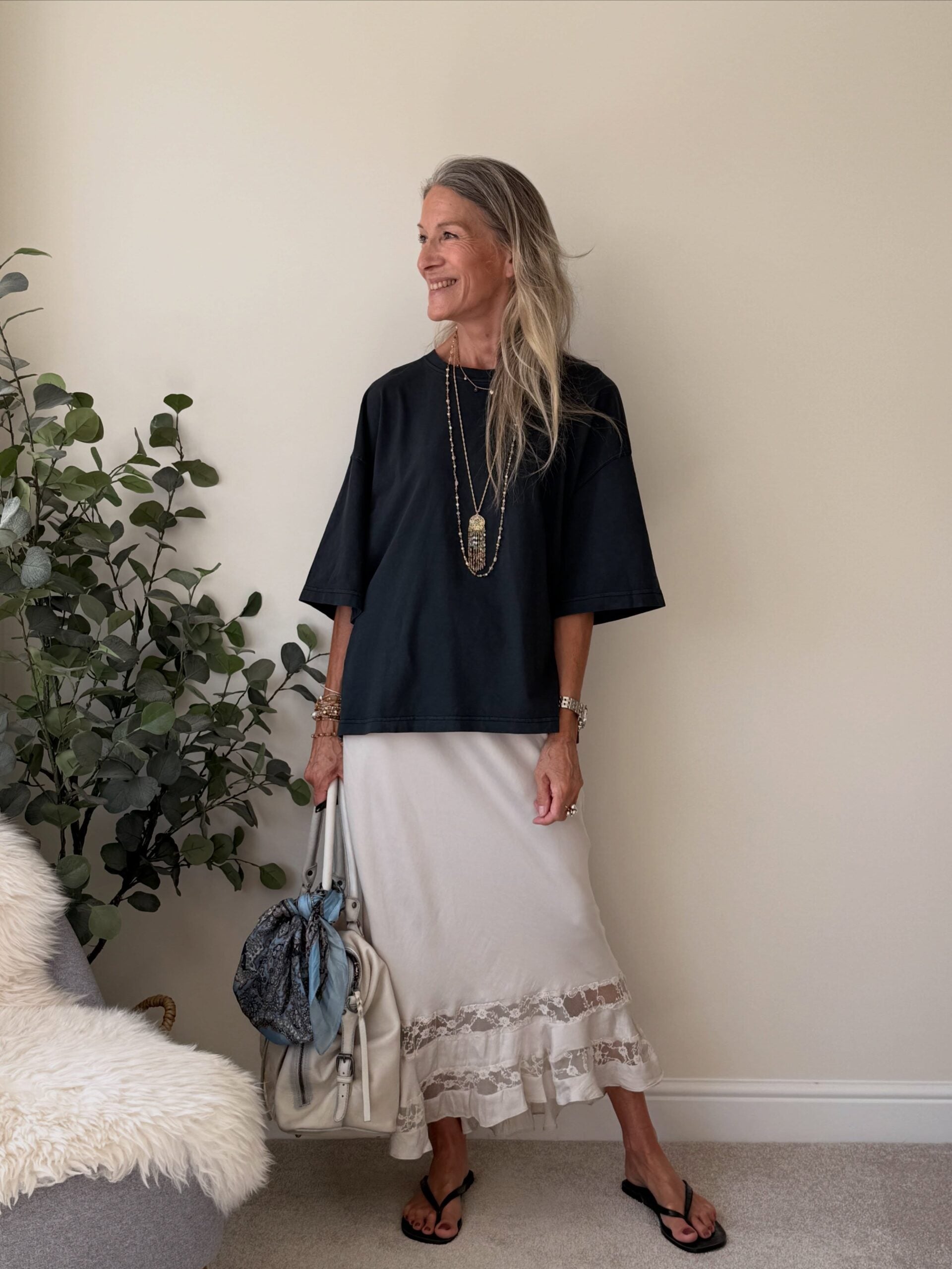 elevated basics outfit with a black top and white maxi skirt