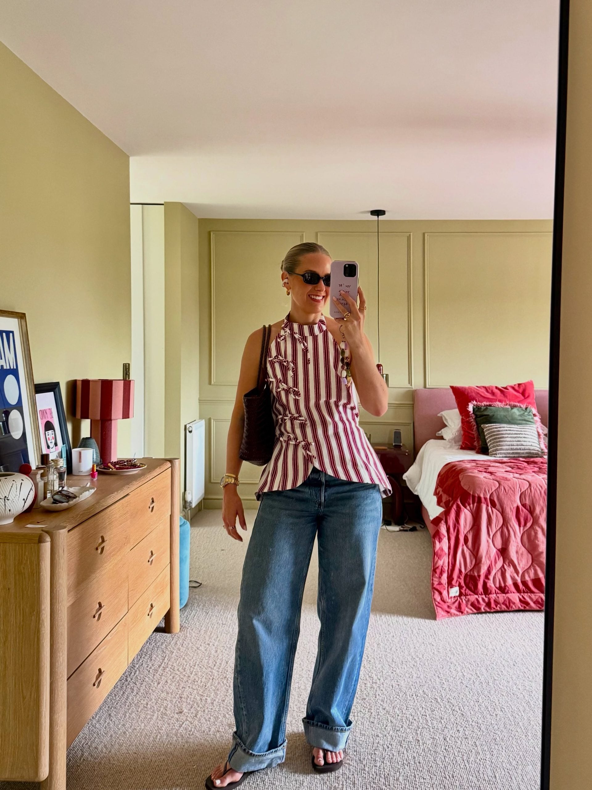 striped halter top with cuffed jeans for a casual outfit over 40