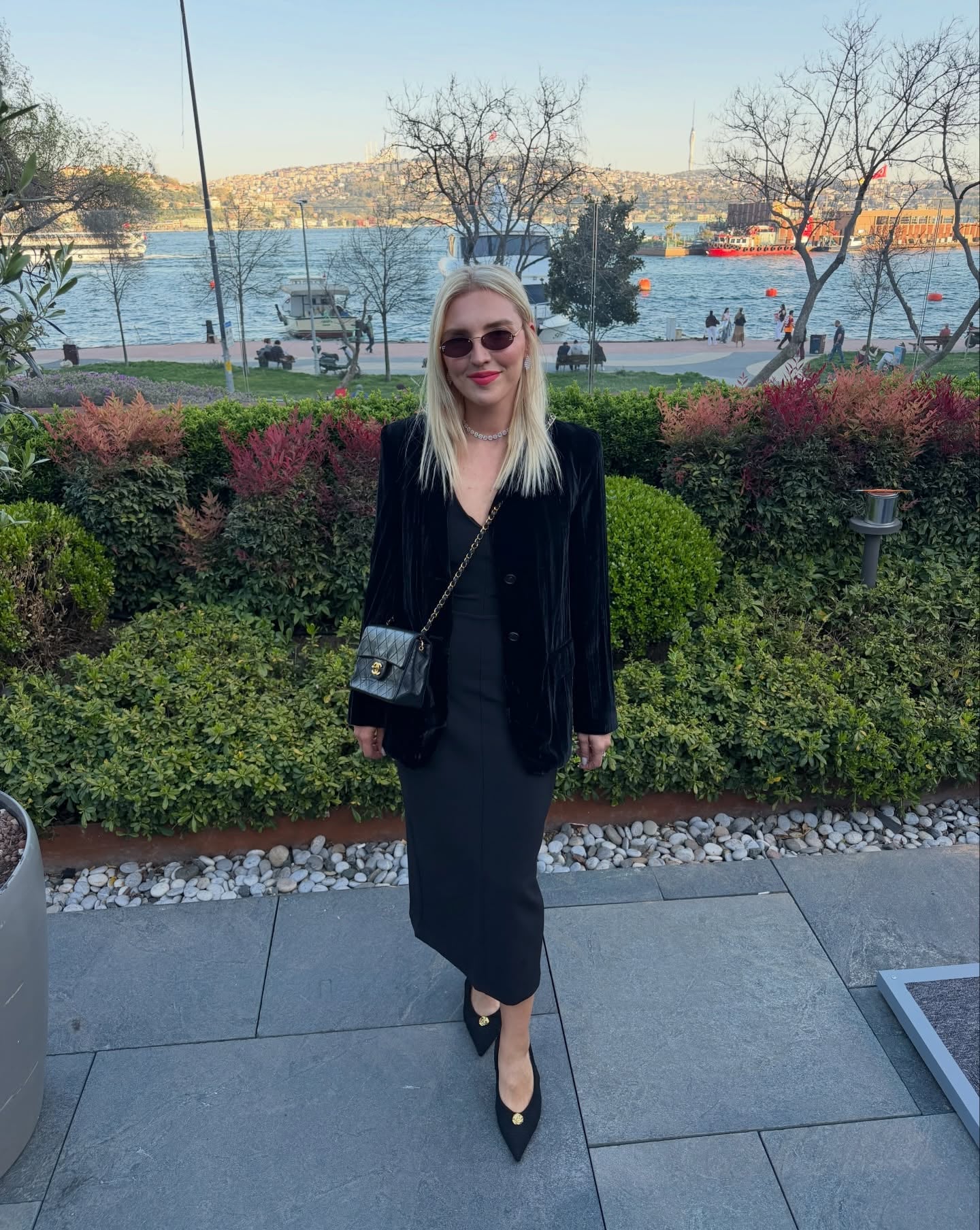 black dress with a velvet blazer and pointed-toe shoes