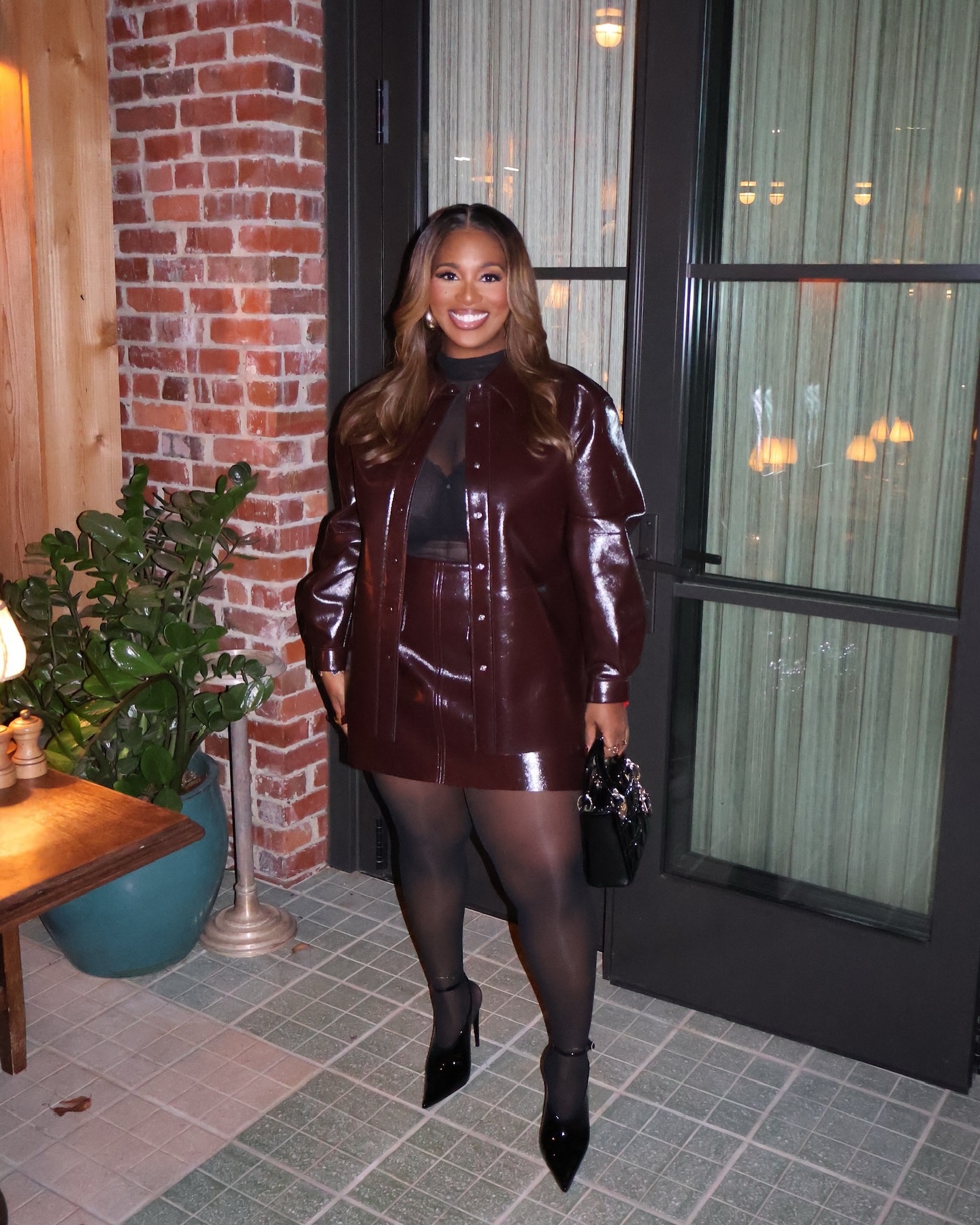 Plus size burgundy holiday party outfit with matching jacket and mini skirt