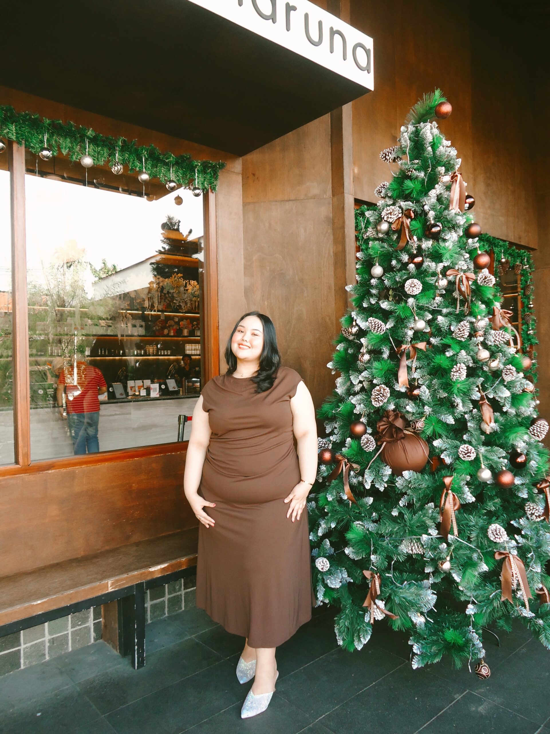 Plus size Christmas dinner outfit with brown midi dress and sparkly silver flats