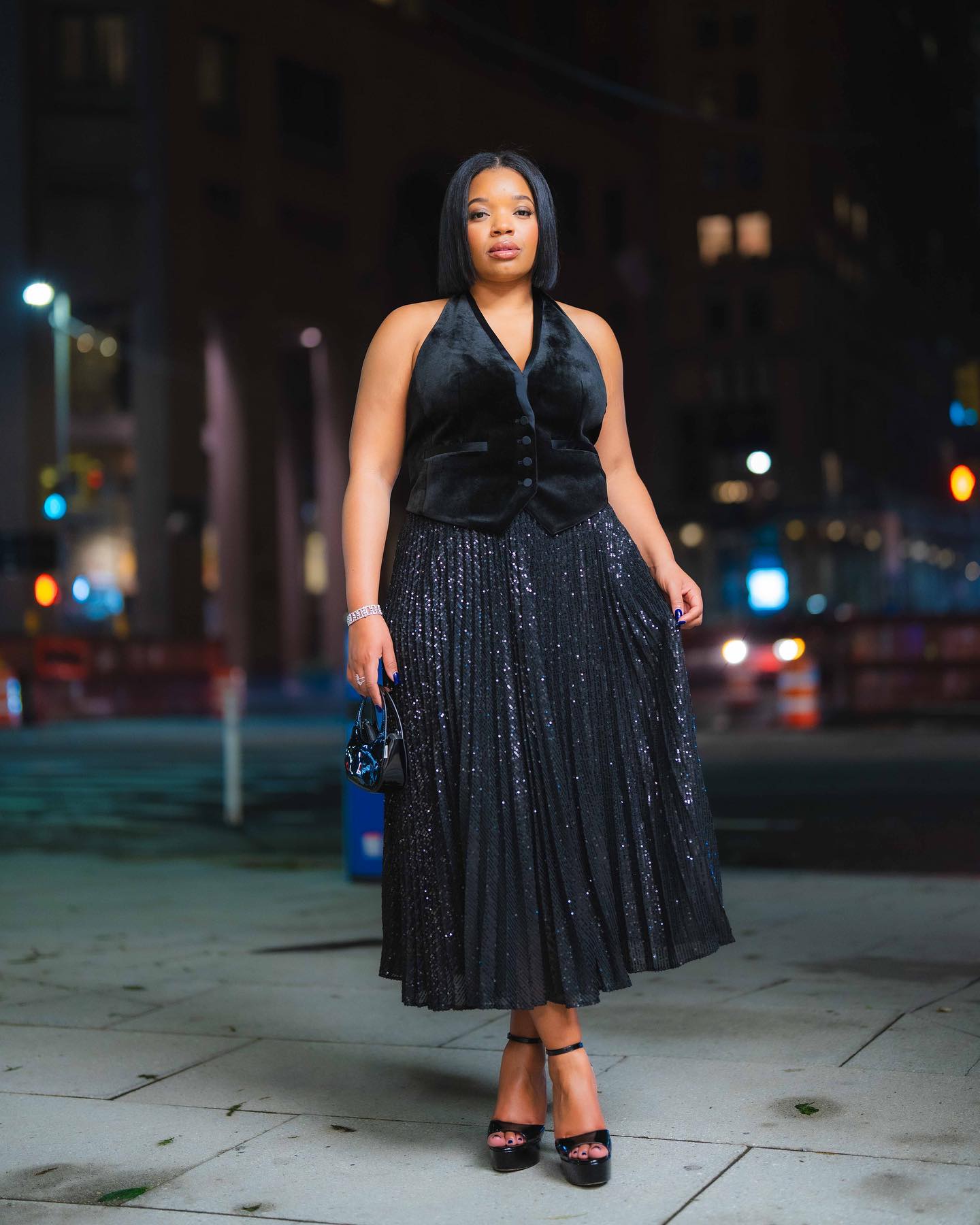 Plus size sequin skirt outfit with black velvet vest and black heels