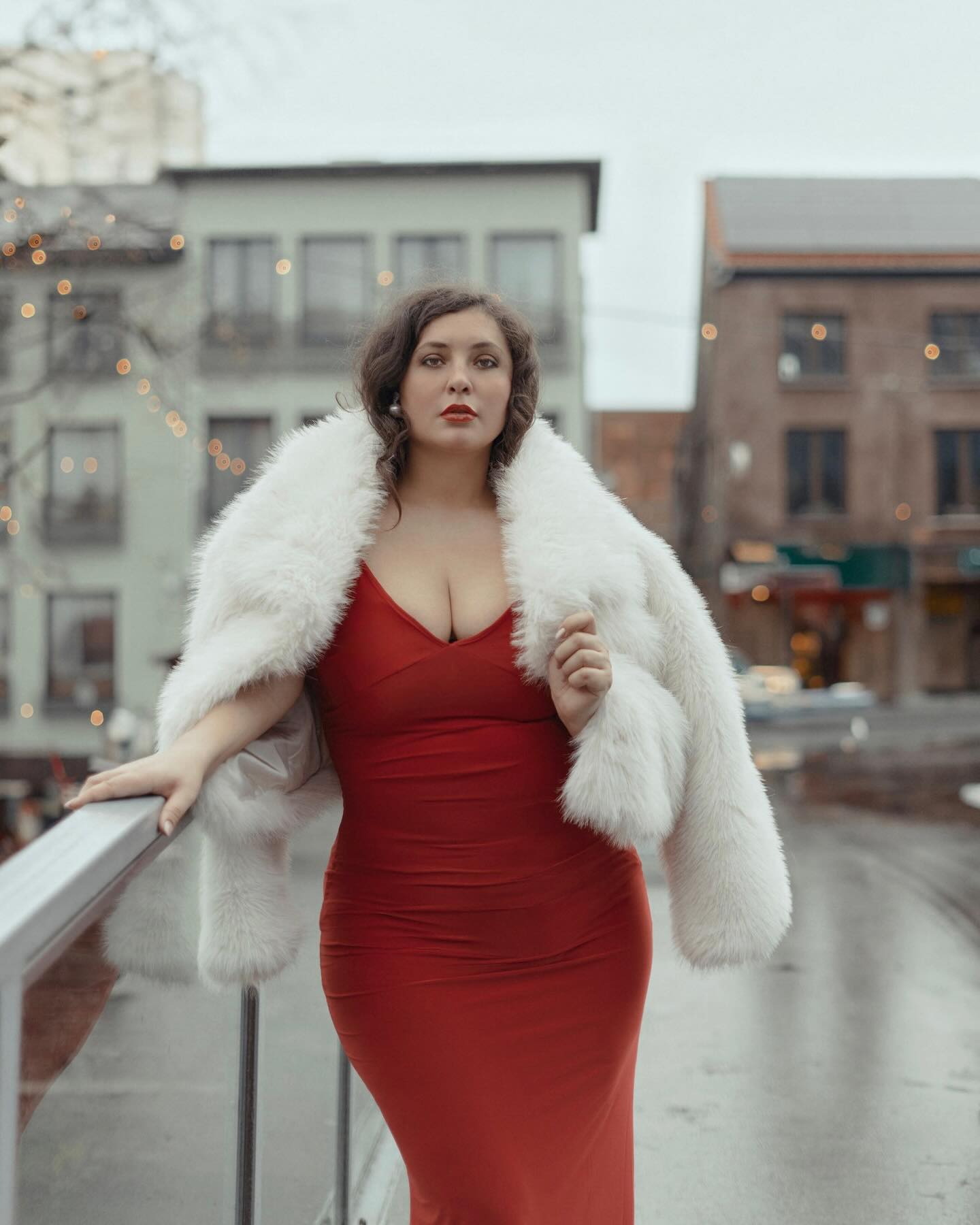 Plus size Christmas party outfit with red maxi dress and white faux-fur coat