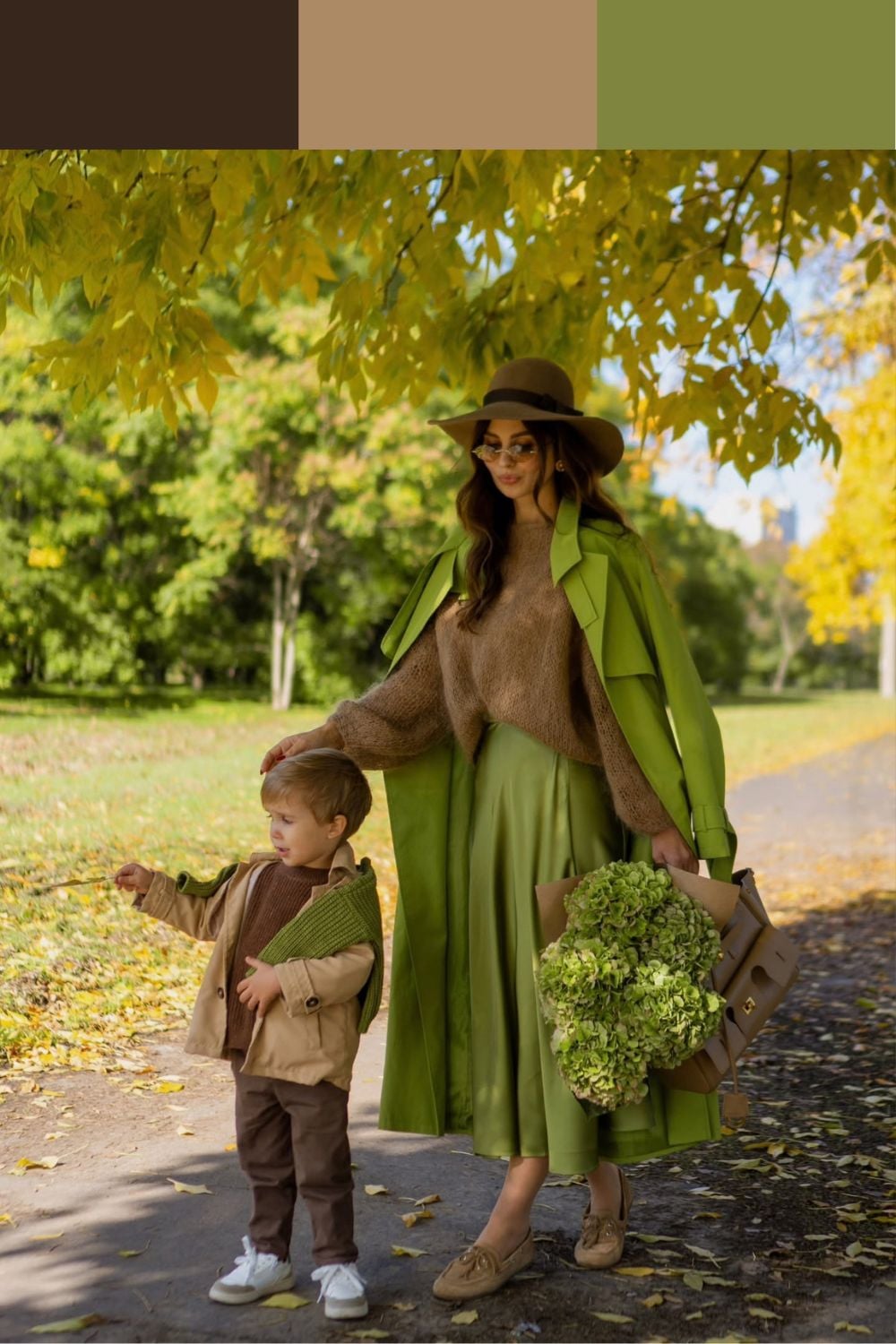 Mother in an olive satin skirt and brown sweater with her son in a camel jacket and chocolate brown trousers