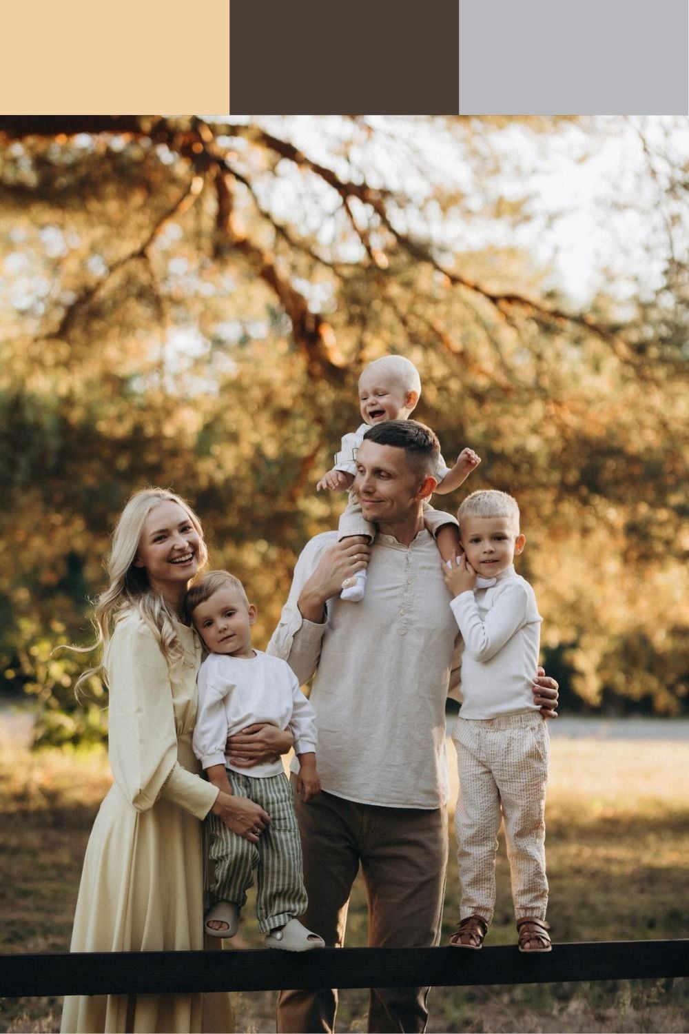 Family of five in cream tops and dresses with chocolate brown and soft gray trousers for outdoor family photos