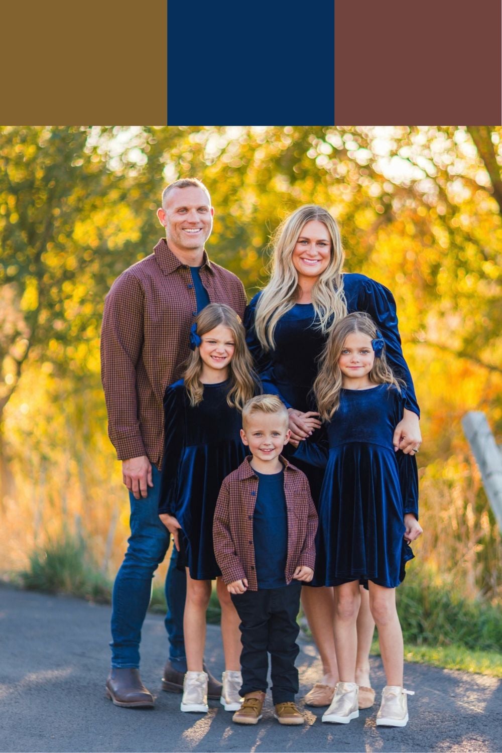 Family of five wearing navy velvet dresses and burgundy overshirts with camel shoes for coordinated fall pictures